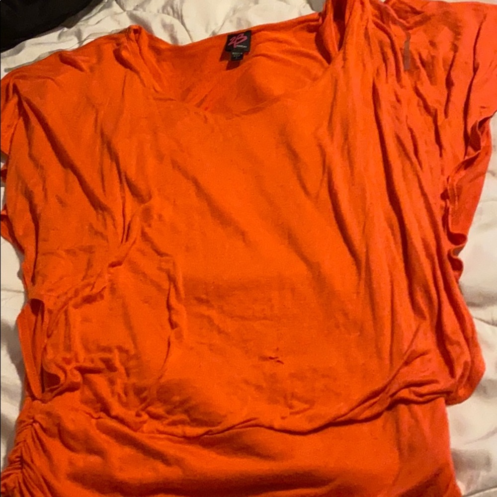 A orange short sleeve shirt